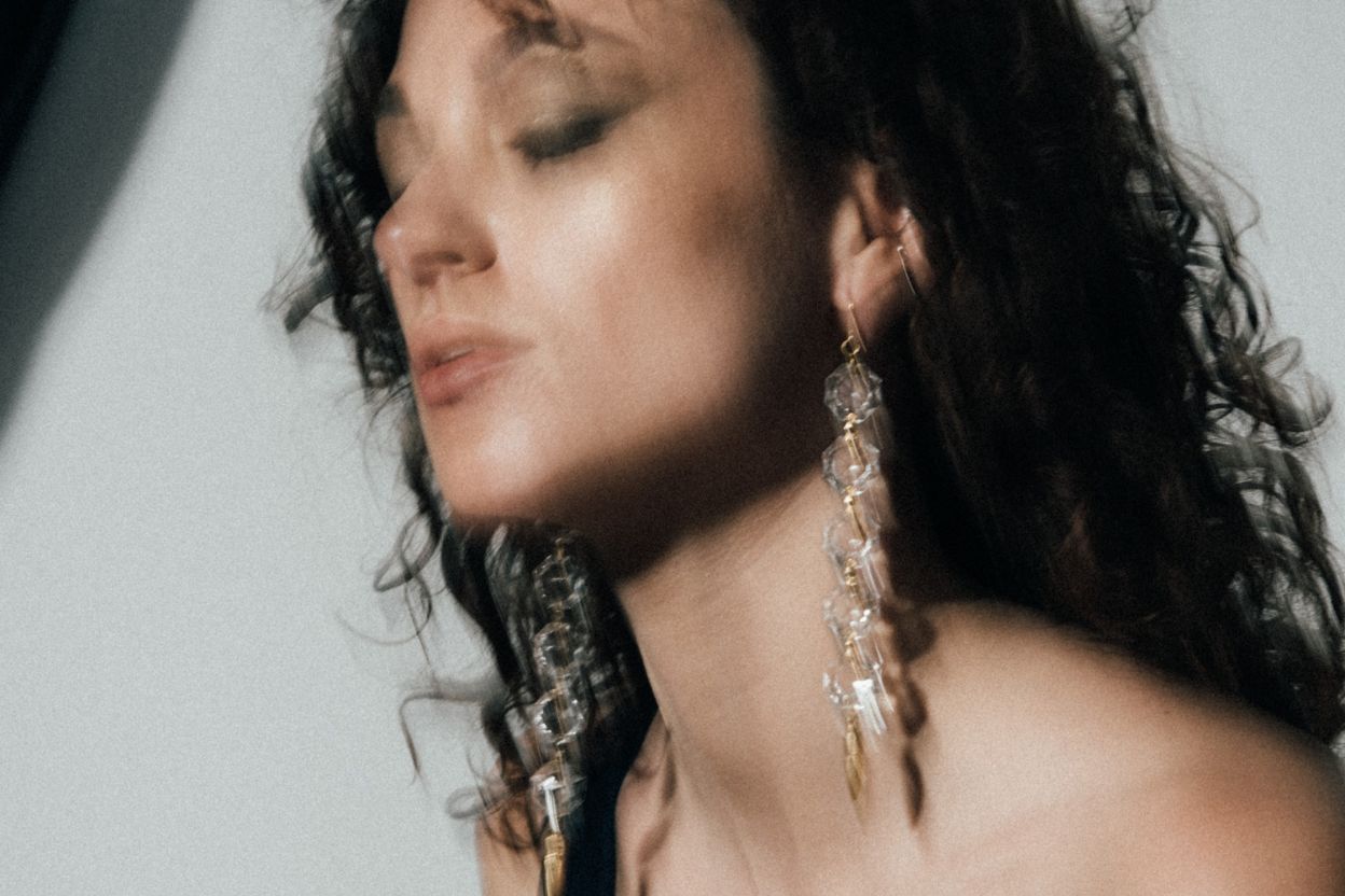 Model in Nototrious Earrings - The Bow Jewelry