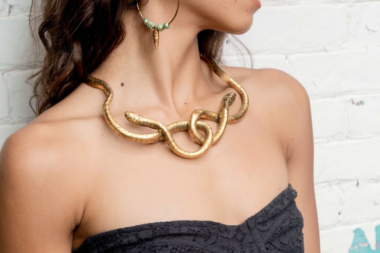 Serpent jewelry collection featuring 18K gold snake rings, earrings, and necklaces | The Bow Jewelry