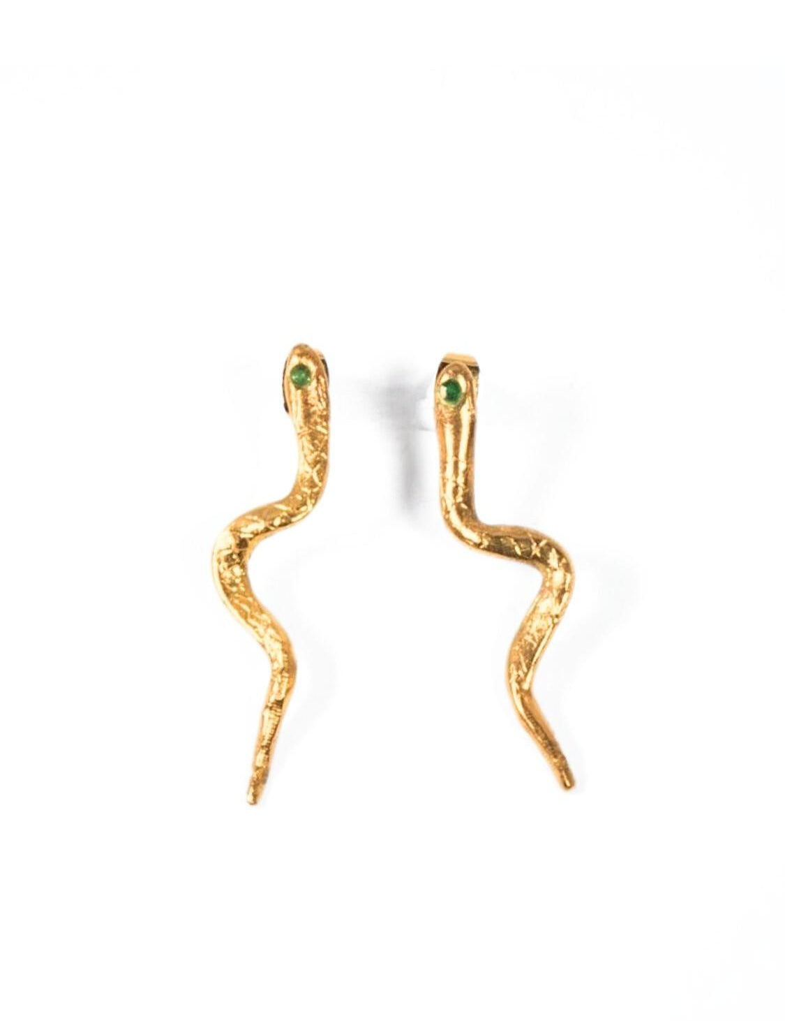 Gold snake-shaped earrings with emerald gemstones on a white background | The Bow Jewelry