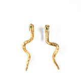 Gold snake-shaped earrings with emerald gemstones on a white background | The Bow Jewelry