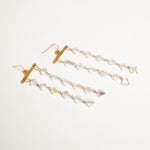 Pair of Fatale gold and crystal earrings | The Bow Jewelry