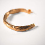 Gold goddess hoop on a white background