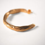 Gold goddess hoop on a white background