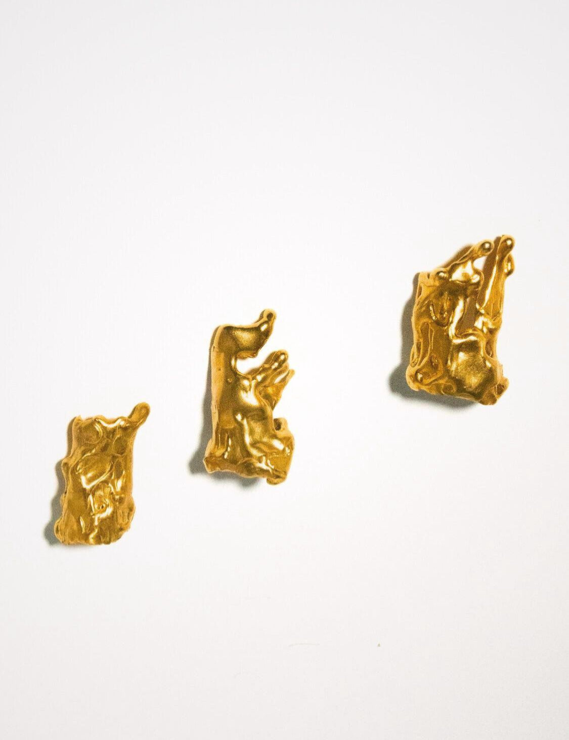 Set of gold finger tip rings on a white background  | The Bow Jewelry