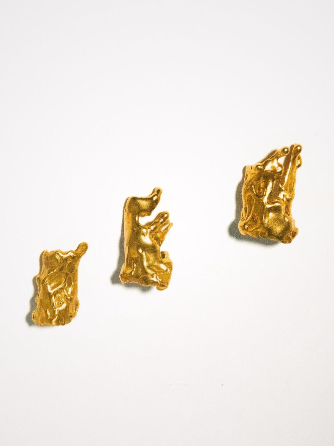 Set of gold finger tip rings on a white background  | The Bow Jewelry