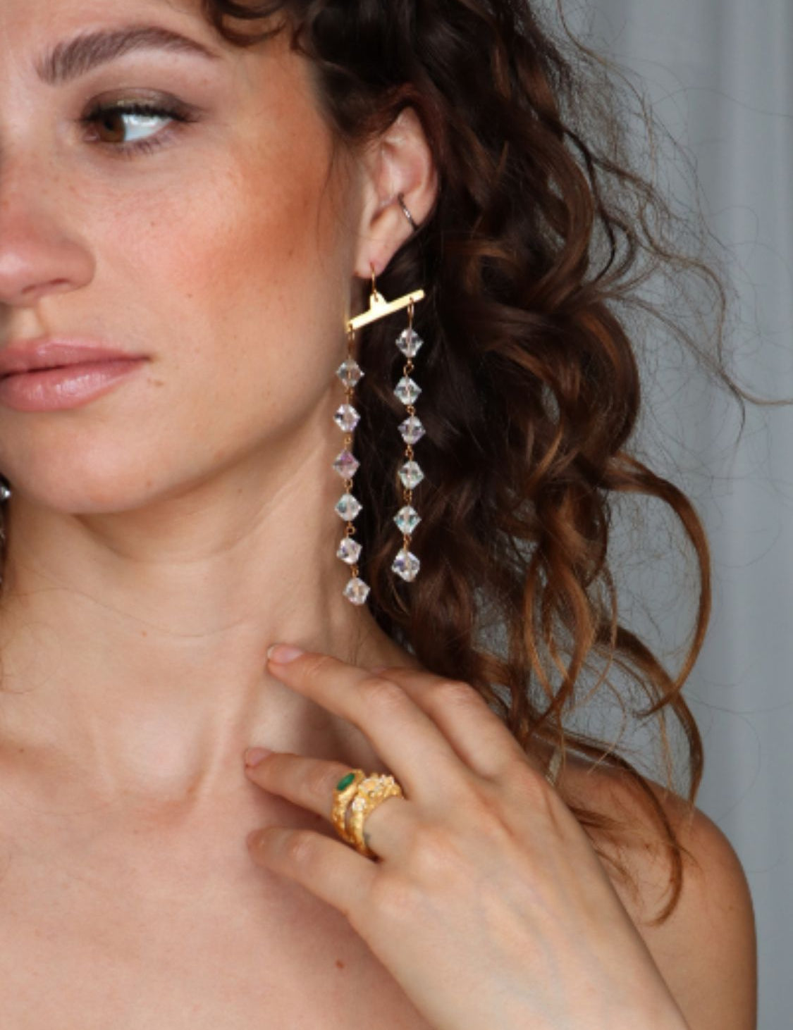 Model wearing Fatale gold and crystal earrings | The Bow Jewelry