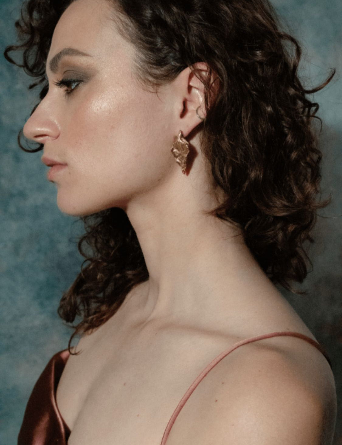 Scythian Arrow Earrings sculptural Jewelry on model profile | The Bow Jewelry