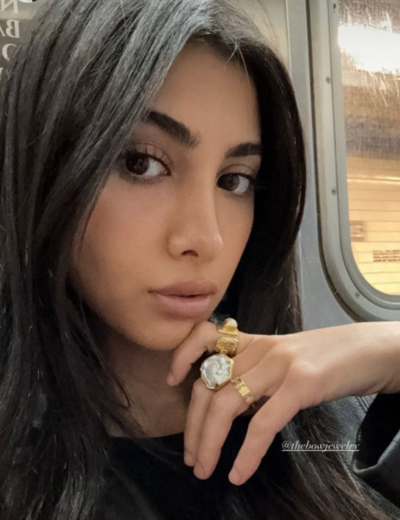 Model wearing sculptural pearl aurora ring — 18kt gold plating symbolic jewelry | The Bow