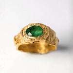 Gold ring with oval emerald on a white background  | The Bow Jewelry