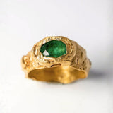 Gold ring with oval emerald on a white background  | The Bow Jewelry