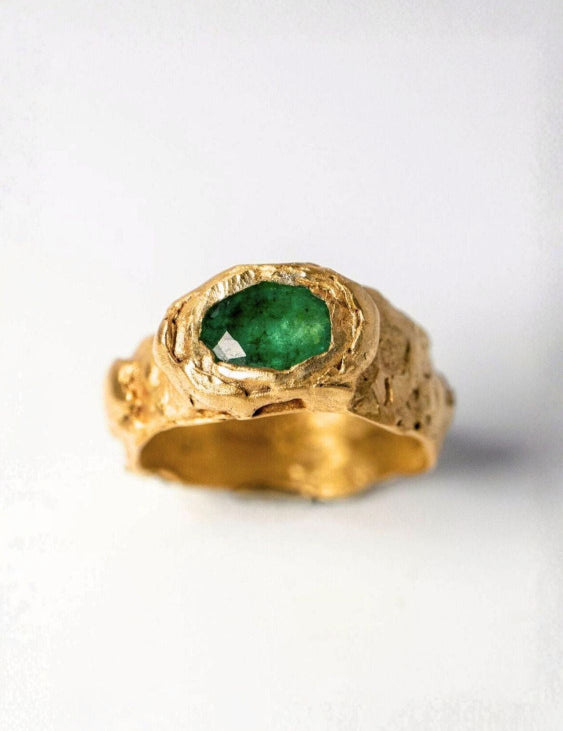 Gold ring with oval emerald on a white background  | The Bow Jewelry