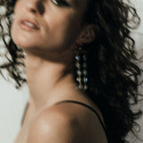 Model wearing Fatale gold and crystal earrings | The Bow Jewelry