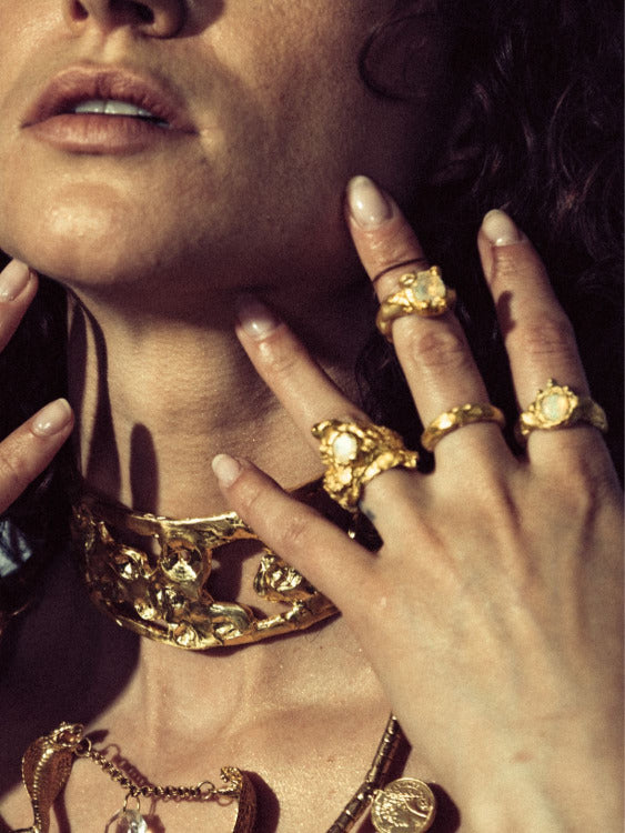 Close-up of Model wearing Divinity Moonstone, Nyx Moonstone, and Zodiac Ring | The Bow Jewelry