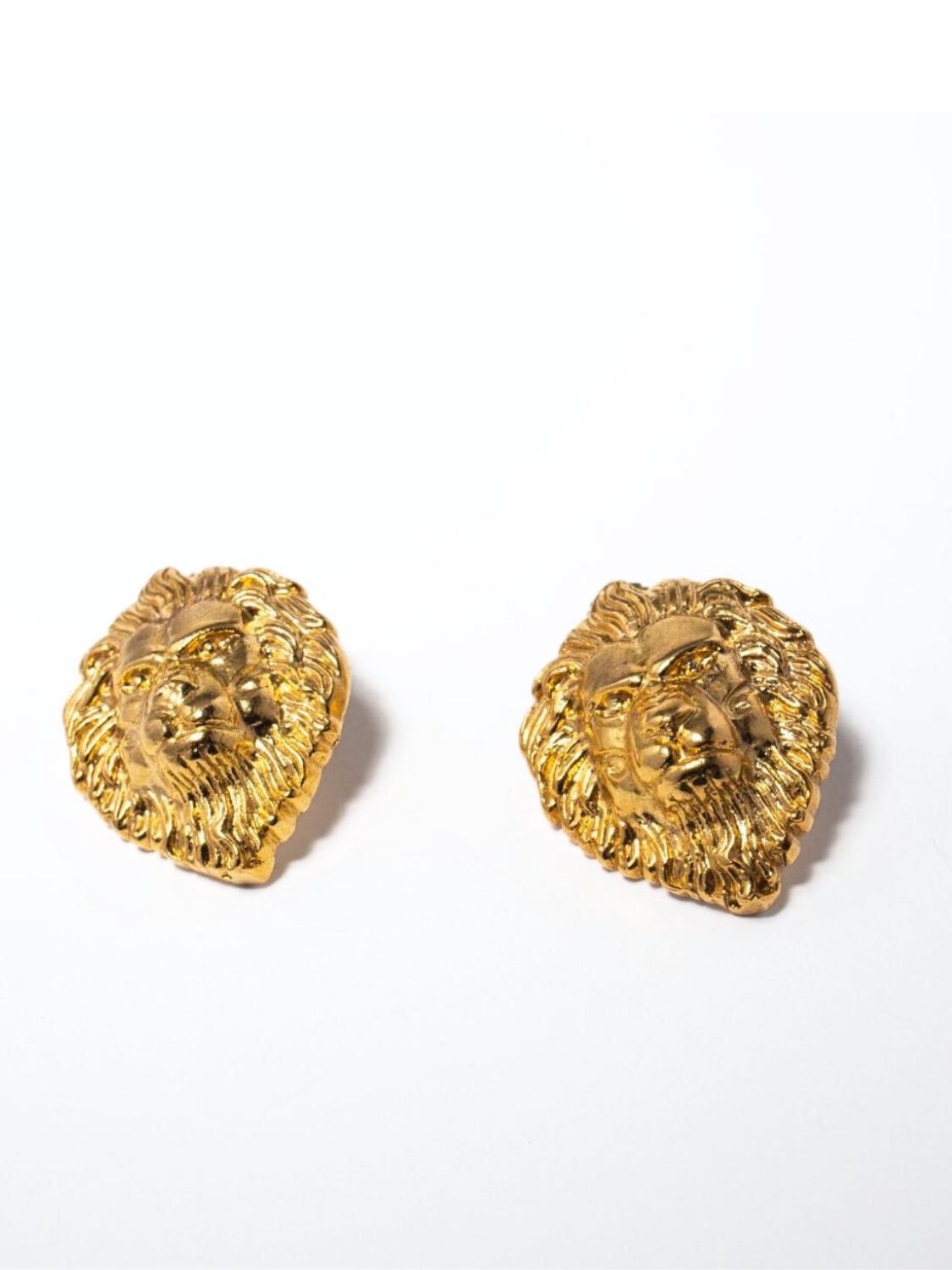 Gold lion head earrings on a white background | The Bow Jewelry