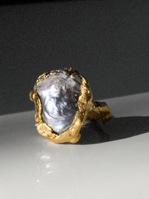Mercury Gold Plated ring with a pearl on a dark surface | The Bow Jewelry