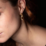 Close-up of model wearing Temptation Snake Emerald Earrings sculptural Jewelry | The Bow Jewelry