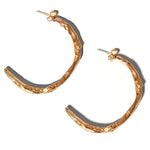 Gold Sculptural Goddess hoop earrings on a light grey background | The Bow Jewelry