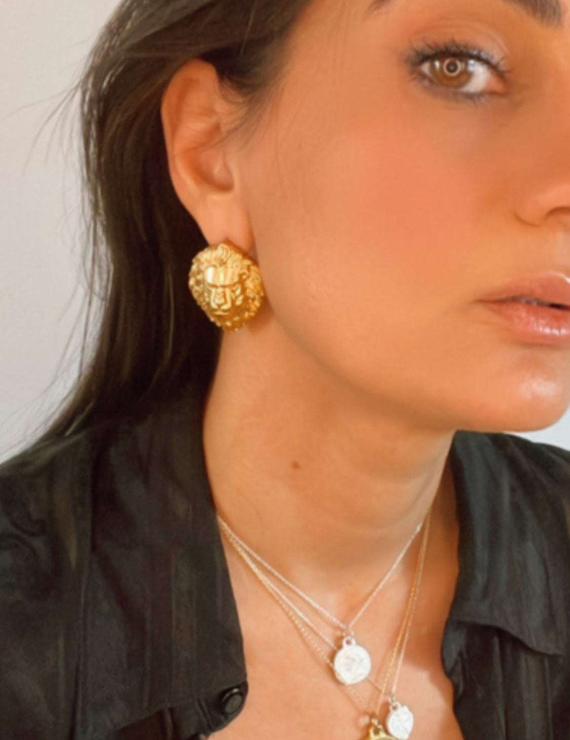 model wearing protector lion symbolic earrings | The Bow Jewelry