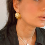model wearing protector lion symbolic earrings | The Bow Jewelry