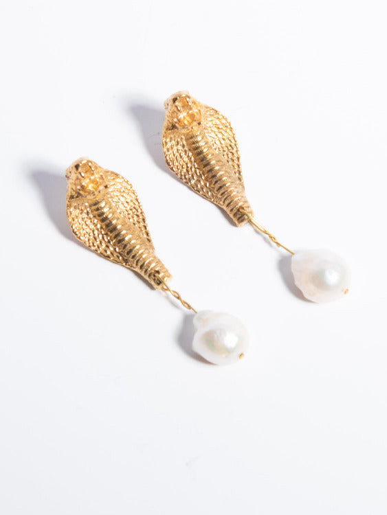 A pair of gold-plated brass earrings featuring baroque pearls and a cobra design on a white background | The Bow Jewelry