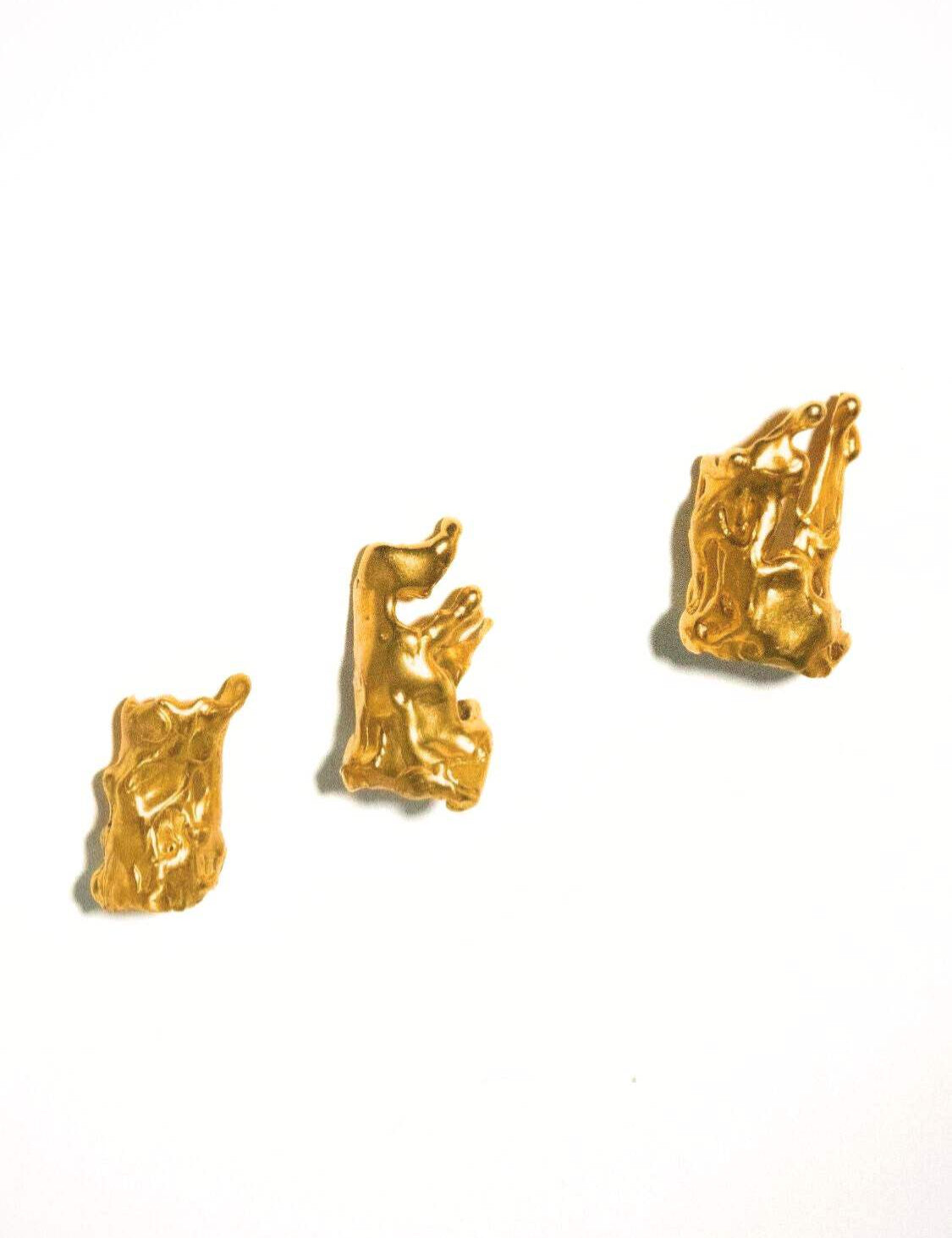 Set of gold finger tip rings on a white background  | The Bow Jewelry