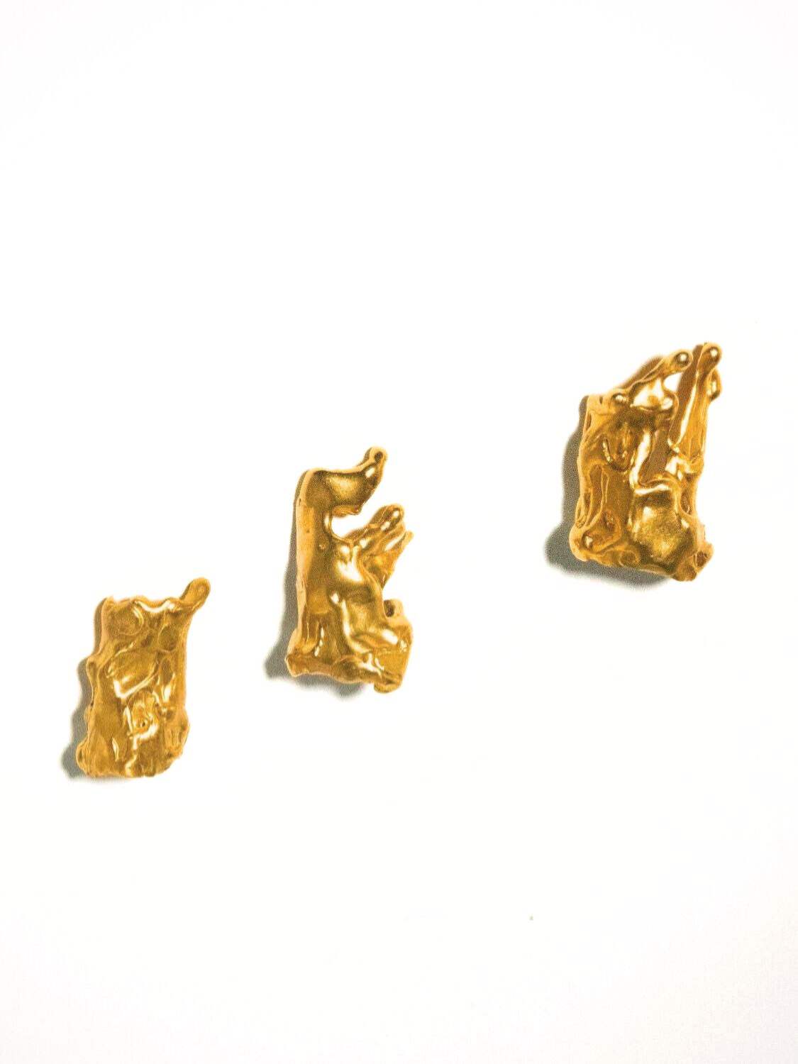 Set of gold finger tip rings on a white background  | The Bow Jewelry