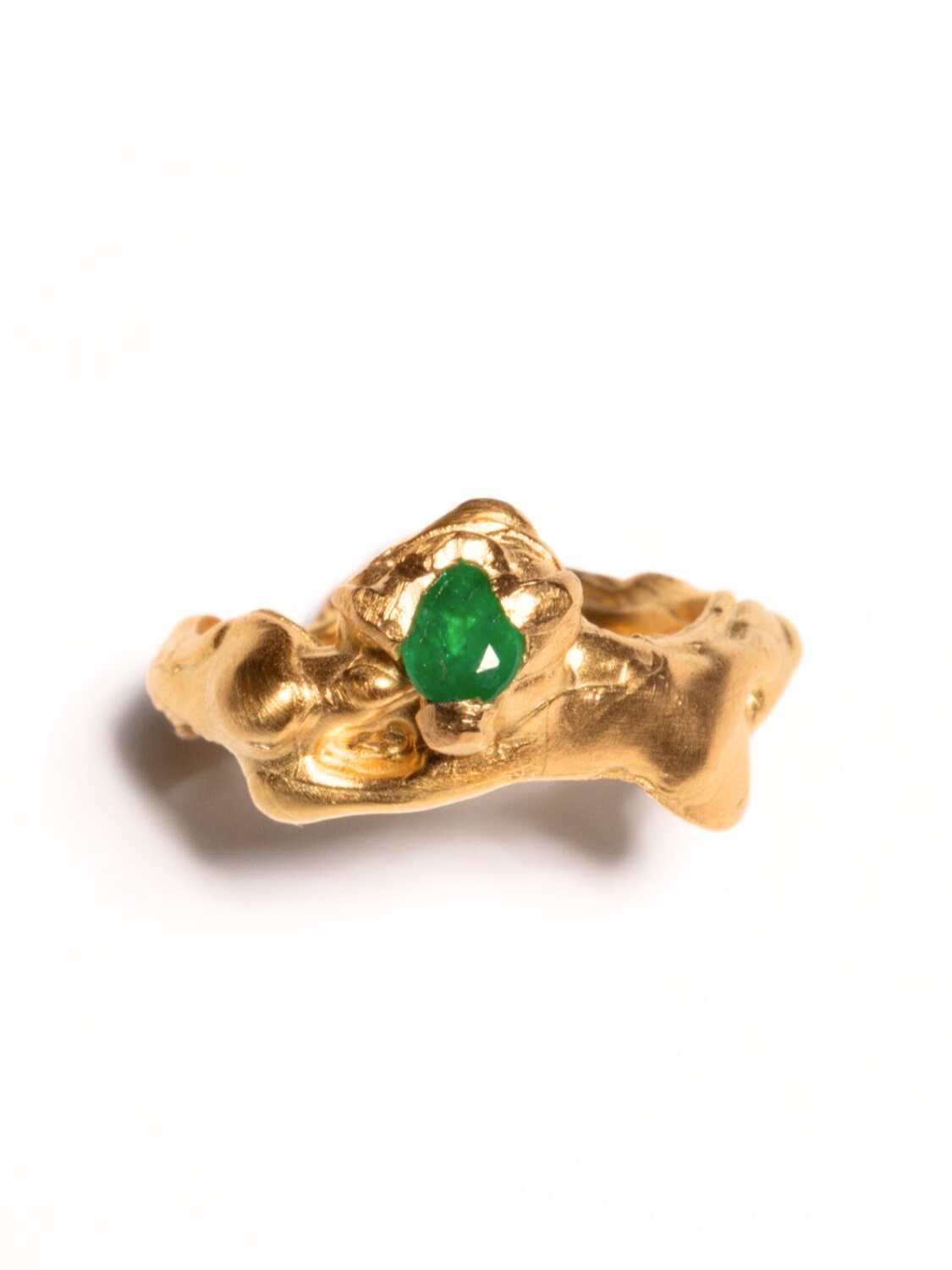 Gold-plated, tear-shaped emerald ring with a metallic band and a single emerald gemstone in the center. | The Bow Jewelry