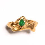 Gold-plated, tear-shaped emerald ring with a metallic band and a single emerald gemstone in the center. | The Bow Jewelry
