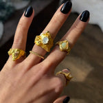 Close-up of a hand wearing a Nyx ring set with a moonstone |The Bow Jewelry