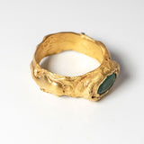 Gold ring with oval emerald on a white background  | The Bow Jewelry
