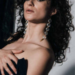 Model wearing Notorious Crystal Chandelier Earrings | The Bow Jewelry