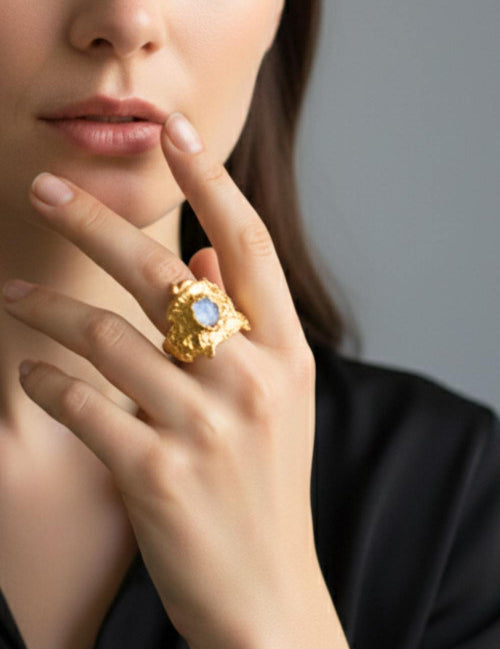 Close-up of a hand wearing a Nyx ring with a moonstone |The Bow Jewelry
