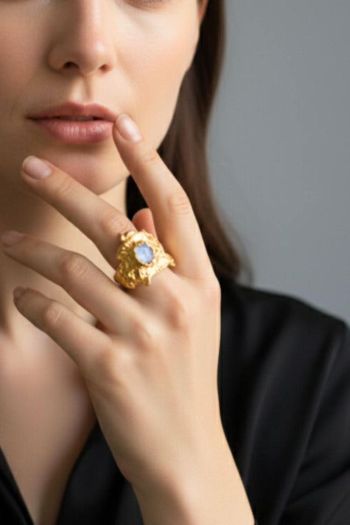 Close-up of a hand wearing a Nyx ring with a moonstone |The Bow Jewelry