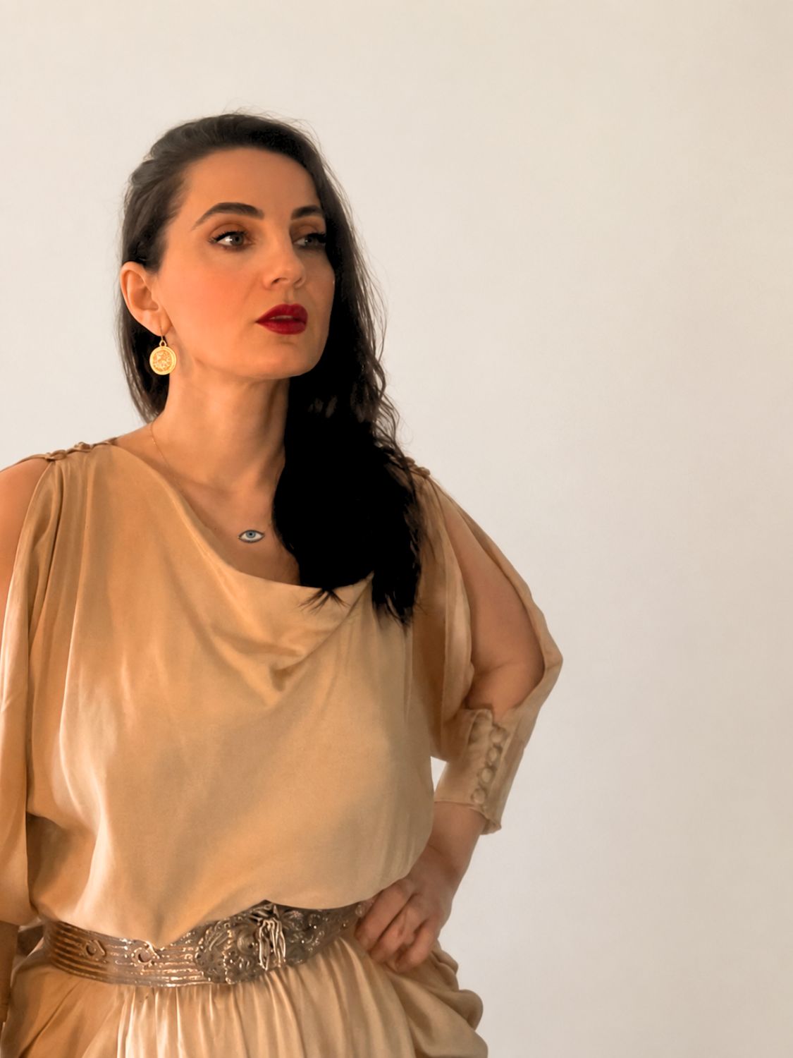 Woman in a beige dress with Warrior Artemisia Earrings | The Bow Jewelry