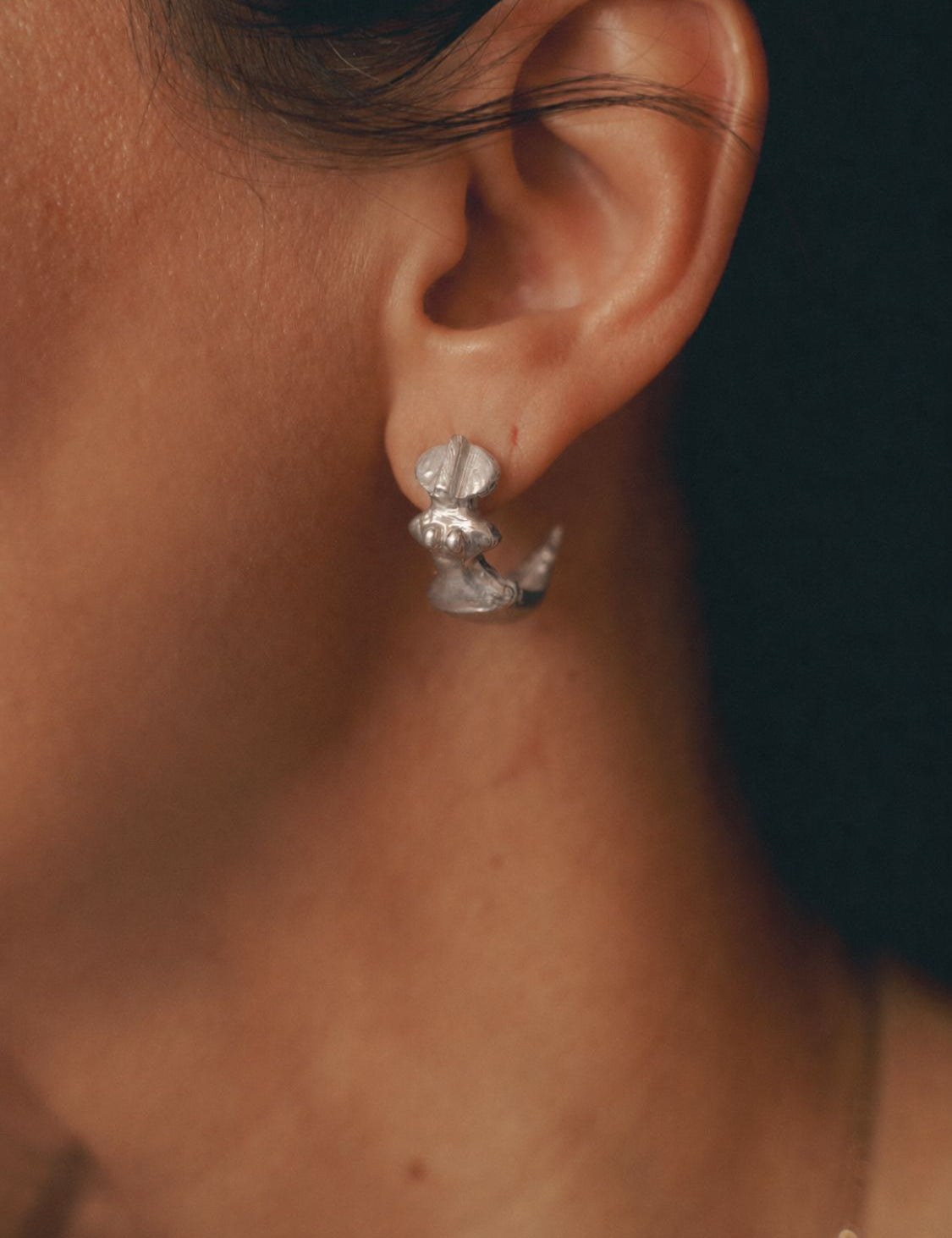 Close-up of Star Idol Earrings in Silver - The Bow Jewery