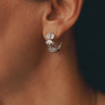 Close-up of Star Idol Earrings in Silver - The Bow Jewery
